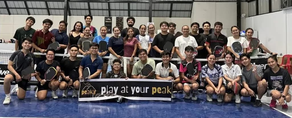 Players at Peak posing with paddles after open play