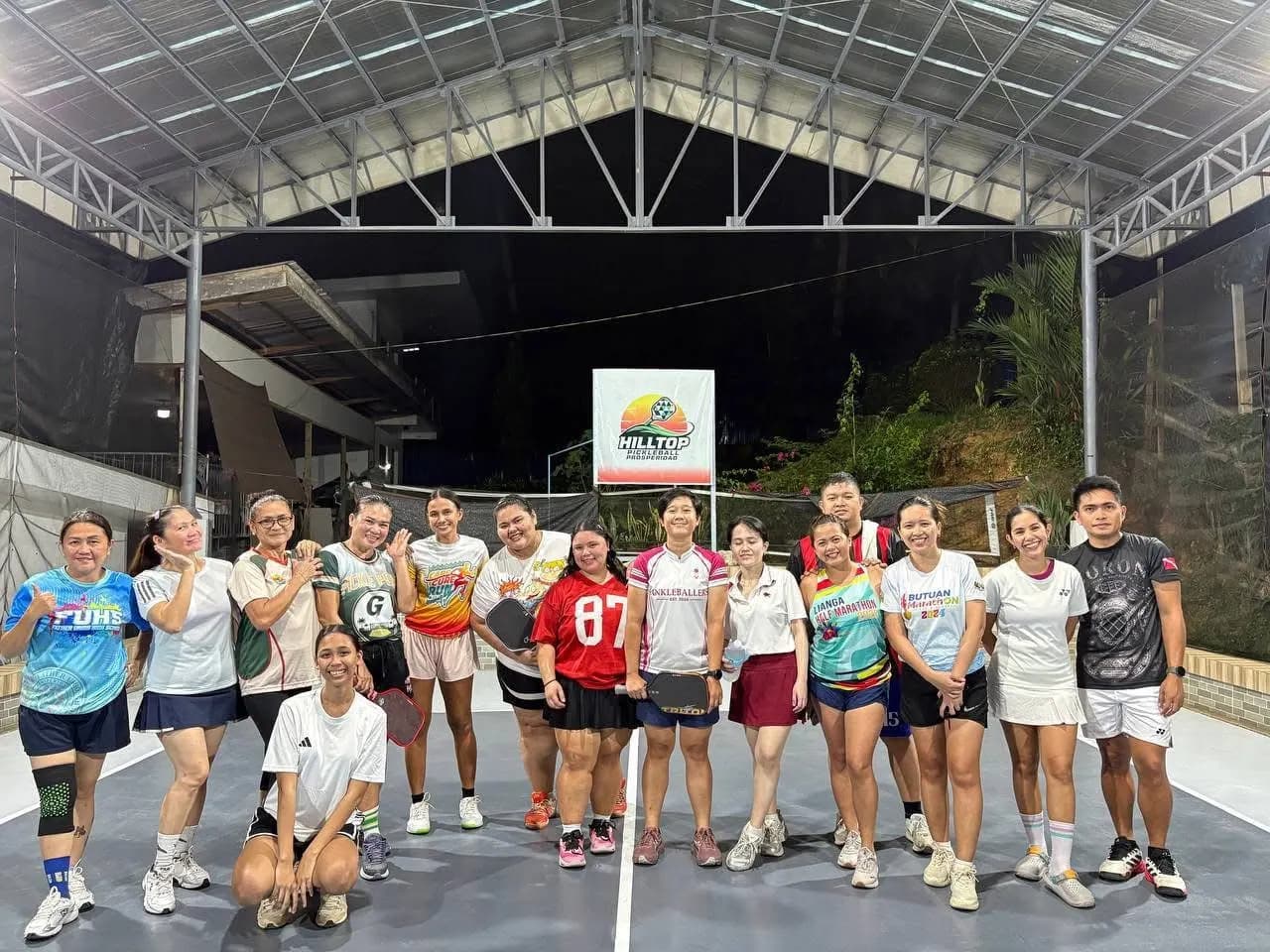 Players at Hilltop Pickleball smiling together after a game