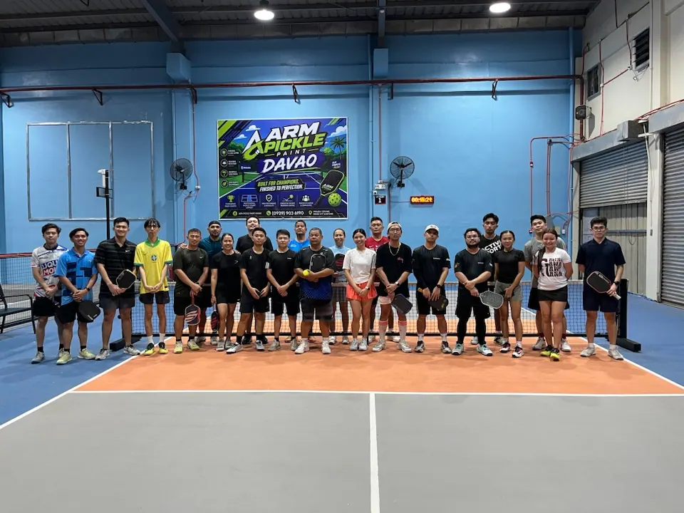 Players lined up across an indoor court in Davao